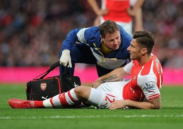 Arsenal's Olivier Giroud Receives Treatment from Physio Colin Lewin during Swansea City Match, Premier League 2014 / 15