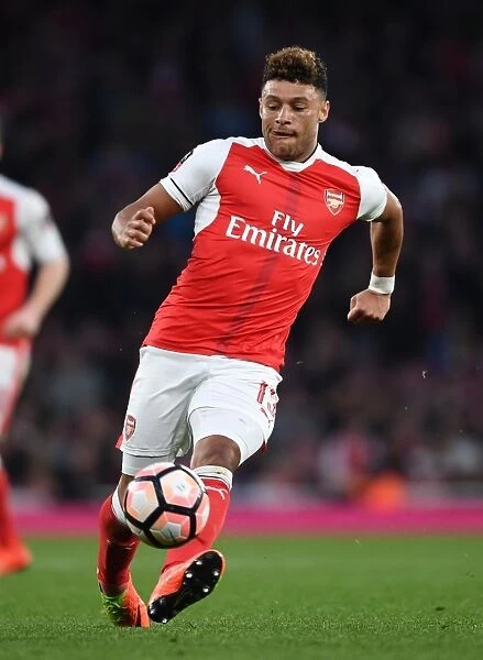 Arsenal's Oxlade-Chamberlain in Action: Emirates FA Cup Quarter-Final Showdown against Lincoln City