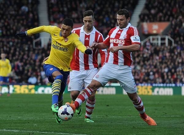 Arsenal's Oxlade-Chamberlain Brakes Past Stoke's Peiters and Arnautovic