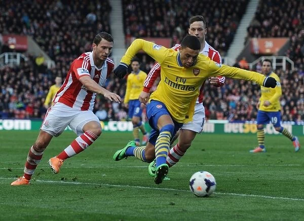 Arsenal's Oxlade-Chamberlain Breezes Past Stoke's Peiters and Arnautovic