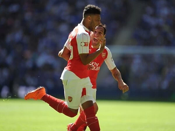 Arsenal's Oxlade-Chamberlain and Cazorla: Celebrating Glory in the Community Shield Clash Against Chelsea