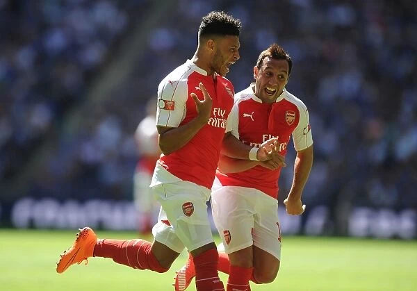 Arsenal's Oxlade-Chamberlain and Cazorla: Celebrating Victory in the Community Shield Clash Against Chelsea