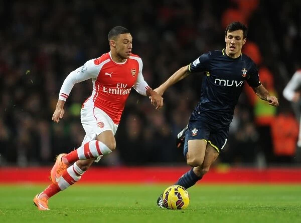Arsenal's Oxlade-Chamberlain Clashes with Southampton's Cork in Premier League Showdown