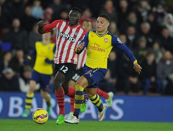 Arsenal's Oxlade-Chamberlain Clashes with Southampton's Wanyama in Premier League Showdown (January 2015)