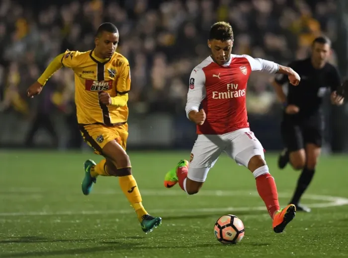 Framed Print : Arsenal's Oxlade-Chamberlain Faces Off Against Sutton's Eastmond: The FA Cup Shock Encounter Framed Print : Arsenal's Oxlade-Chamberlain Faces Off Against Sutton's Eastmond: The FA Cup Shock Encounter