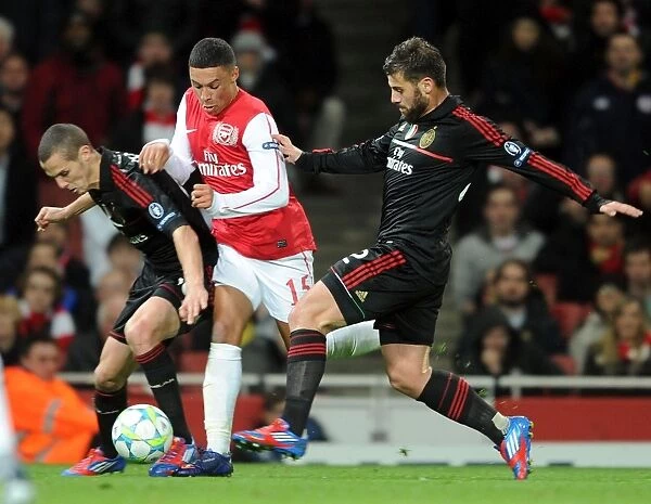 Arsenal's Oxlade-Chamberlain Fouled as Arsenal Crush AC Milan 3-0 in UEFA Champions League