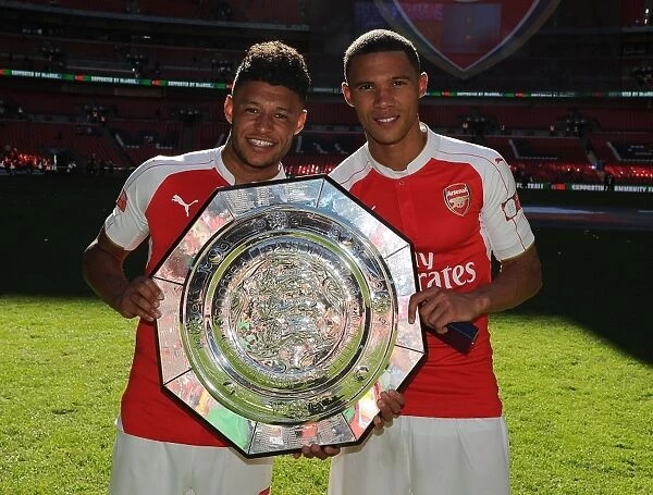 Arsenal's Oxlade-Chamberlain and Gibbs Celebrate after Community Shield Victory over Chelsea