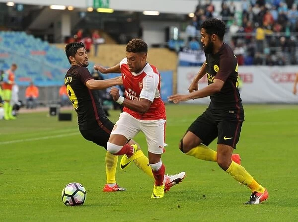 Arsenal's Oxlade-Chamberlain Goes Head-to-Head with Clichy and Nolito in Arsenal vs Manchester City Pre-Season Clash