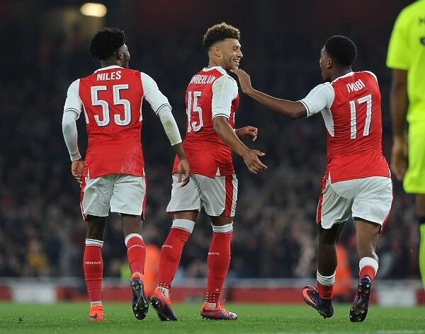 Arsenal's Oxlade-Chamberlain, Maitland-Niles, and Iwobi Celebrate Goals Against Reading in EFL Cup