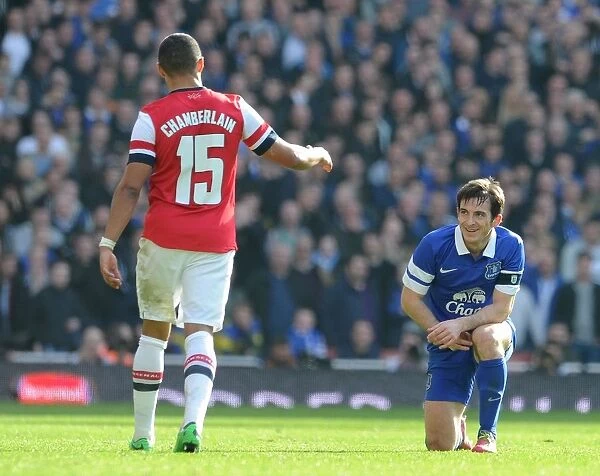 Arsenal's Oxlade-Chamberlain Offers A Hand to Everton's Baines in FA Cup Quarter-Final
