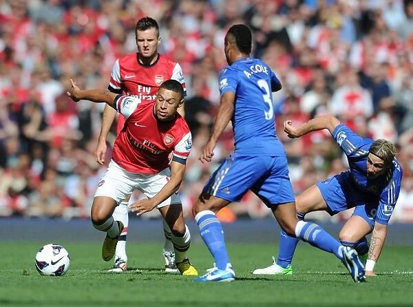 Arsenal's Oxlade-Chamberlain Outmaneuvers Chelsea's Torres and Cole