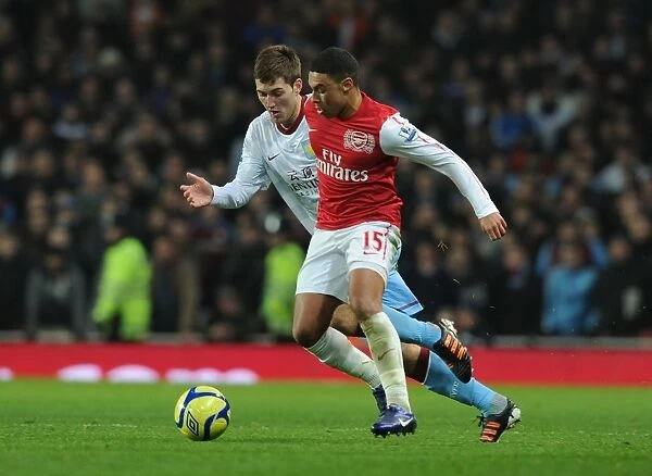 Arsenal's Oxlade-Chamberlain Outmaneuvers Aston Villa's Gardner in FA Cup Clash