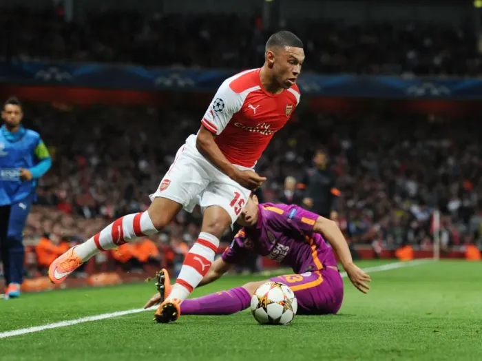 Framed Print : Arsenal's Oxlade-Chamberlain Outmaneuvers Galatasaray's Telles in 2014 Champions League Clash Framed Print : Arsenal's Oxlade-Chamberlain Outmaneuvers Galatasaray's Telles in 2014 Champions League Clash