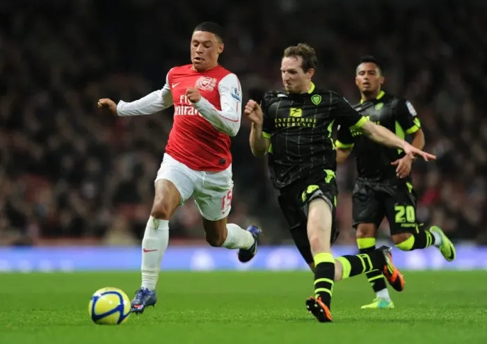 Framed Print : Arsenal's Oxlade-Chamberlain Outsmarts Leeds White in FA Cup Showdown Framed Print : Arsenal's Oxlade-Chamberlain Outsmarts Leeds White in FA Cup Showdown