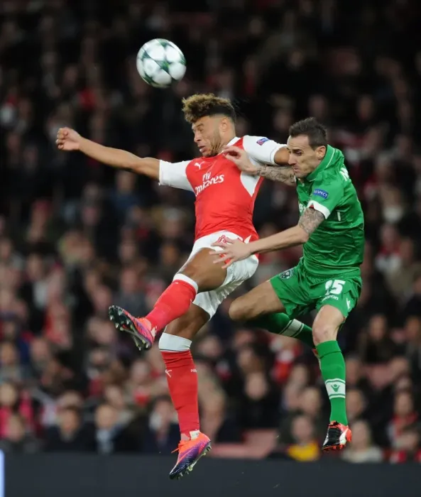 Framed Print : Arsenal's Oxlade-Chamberlain Soars Past Ludogorets Minev in Champions League Clash