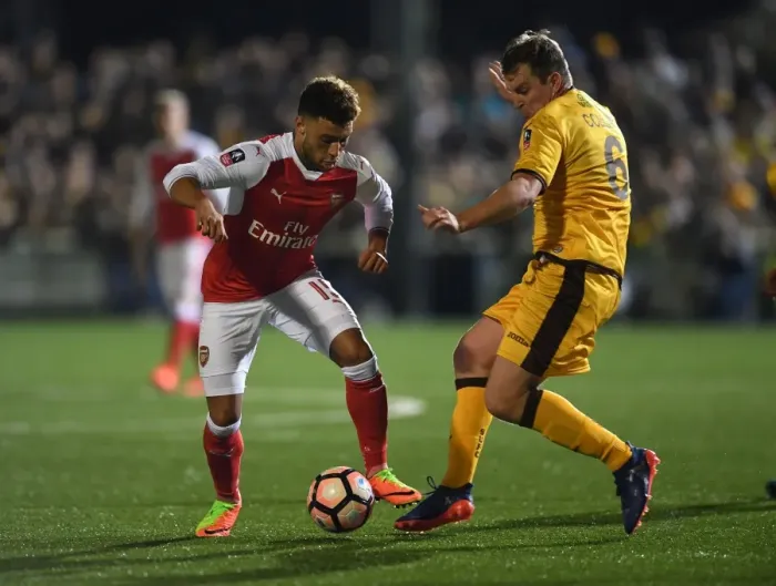 Framed Print : Arsenal's Oxlade-Chamberlain vs Collins: A FA Cup Fifth Round Battle Framed Print : Arsenal's Oxlade-Chamberlain vs Collins: A FA Cup Fifth Round Battle