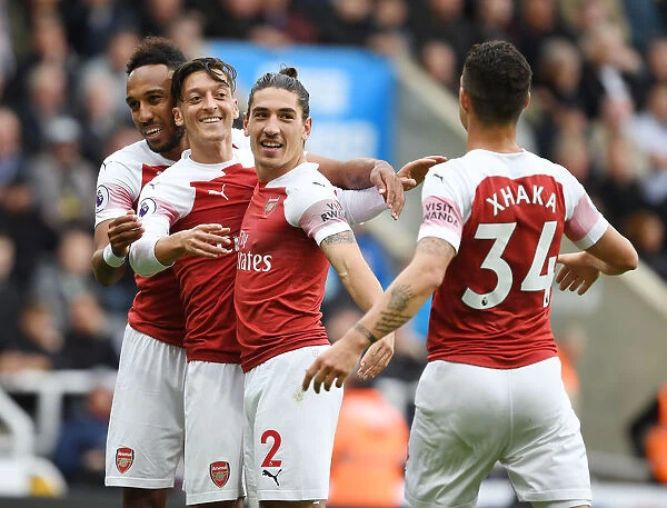 Arsenal's Ozil, Aubameyang, Bellerin, and Xhaka Celebrate Goals Against Newcastle United