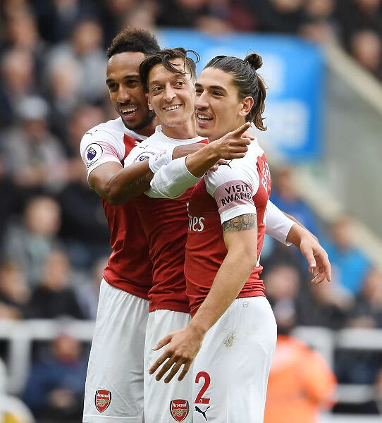 Arsenal's Ozil, Aubameyang, and Bellerin Celebrate Goals Against Newcastle United