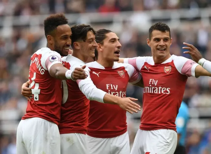 Framed Print : Arsenal's Ozil, Bellerin, Aubameyang, and Xhaka Celebrate Goals Against Newcastle United