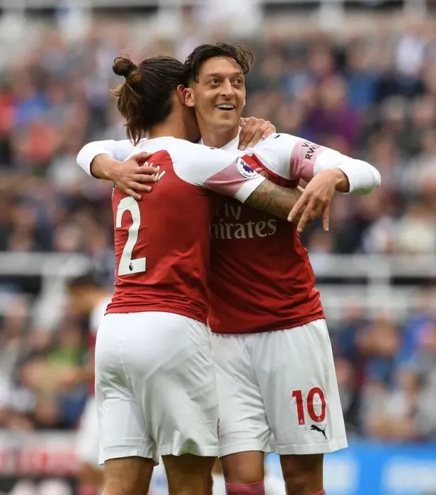 Framed Print : Arsenal's Ozil and Bellerin: A Celebratory Moment after Scoring against Newcastle United Framed Print : Arsenal's Ozil and Bellerin: A Celebratory Moment after Scoring against Newcastle United