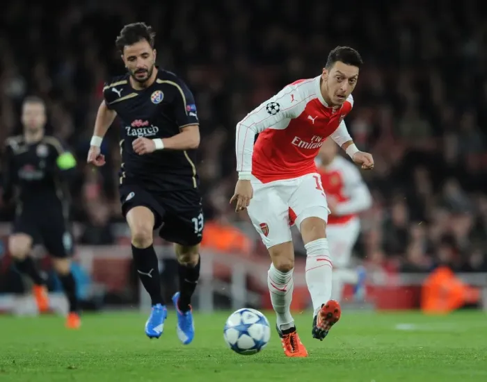 Framed Print : Arsenal's Ozil Dodges Pressure from Dinamo Zagreb's Goncalo Santos in 2015-16 Champions League Showdown Framed Print : Arsenal's Ozil Dodges Pressure from Dinamo Zagreb's Goncalo Santos in 2015-16 Champions League Showdown