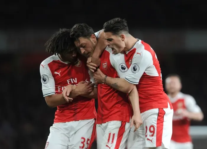 Framed Print : Arsenal's Ozil, Elneny, and Xhaka Celebrate Goal Against West Ham United Framed Print : Arsenal's Ozil, Elneny, and Xhaka Celebrate Goal Against West Ham United