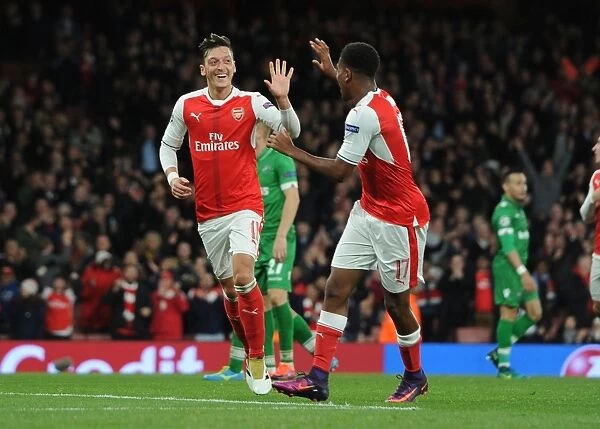 Arsenal's Ozil and Iwobi: Celebrating Goals Against Ludogorets in the 2016-17 Champions League