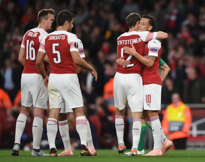 Framed Print : Arsenal's Ozil and Lichtsteiner: Celebrating Goals in Europa League Victory