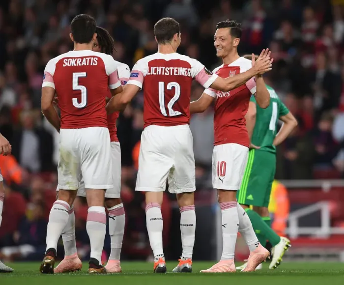 Framed Print : Arsenal's Ozil and Lichtsteiner: Unstoppable Duo Celebrates Goals Against Vorskla Poltava