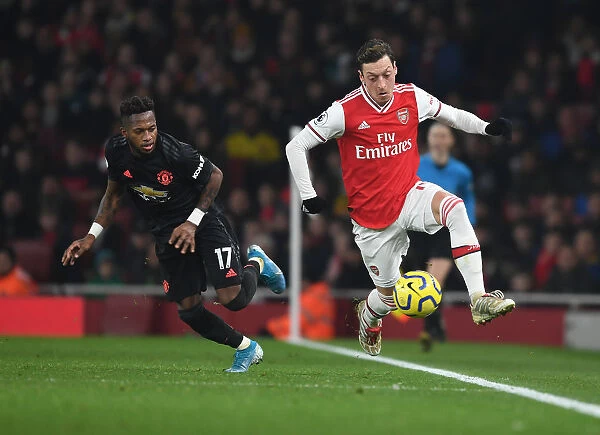 Arsenal's Ozil Outmaneuvers Manchester United's Fred in Premier League Clash