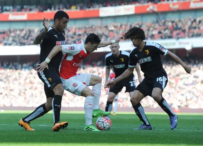 Framed Print : Arsenal's Ozil Outmaneuvers Watford Defenders in FA Cup Showdown Framed Print : Arsenal's Ozil Outmaneuvers Watford Defenders in FA Cup Showdown