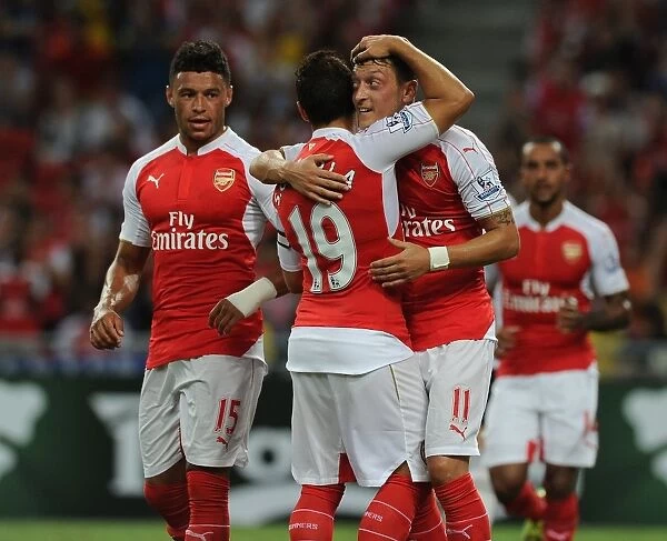 Arsenal's Ozil, Oxlade-Chamberlain, and Cazorla Celebrate Goals Against Everton in 2015-16 Asia Trophy