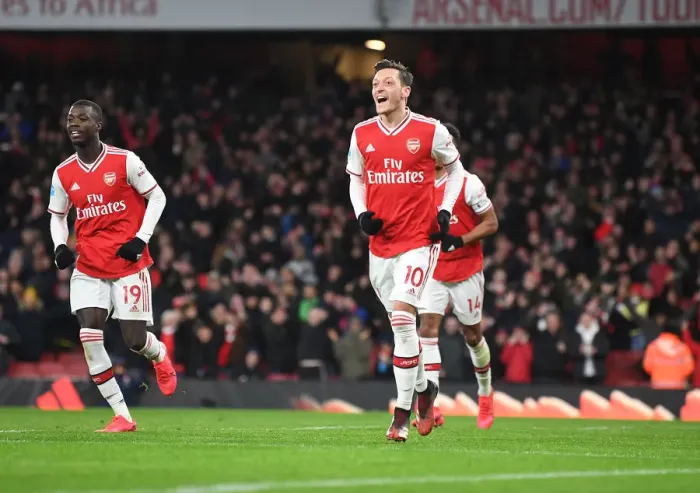 Framed Print : Arsenal's Ozil Scores Third Goal in Exciting Victory over Newcastle United