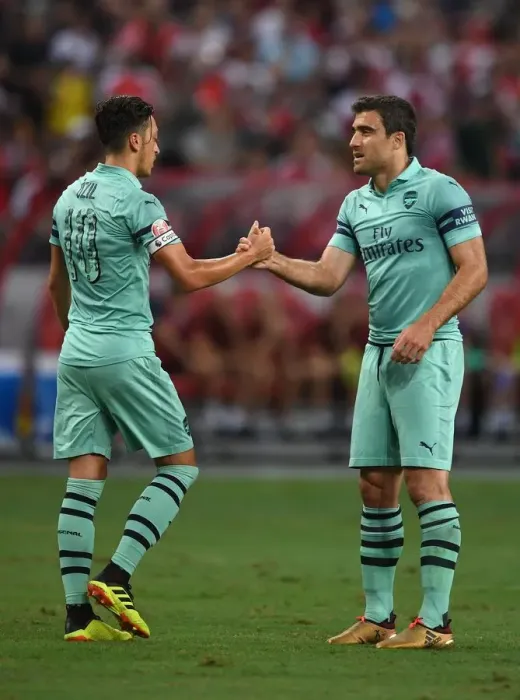 Framed Print : Arsenal's Ozil and Sokratis: Unity in Victory - Celebrating a Goal Against Paris Saint-Germain in the 2018 International Champions Cup (Singapore) Framed Print : Arsenal's Ozil and Sokratis: Unity in Victory - Celebrating a Goal Against Paris Saint-Germain in the 2018 International Champions Cup (Singapore)
