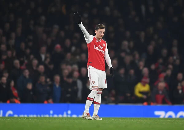 Arsenal's Ozil Waves to Fans Amidst Arsenal vs Manchester United Rivalry (2019-20)