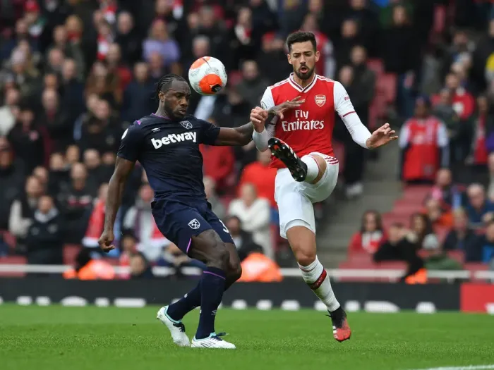 Framed Print : Arsenal's Pablo Mari Fends Off West Ham's Michail Antonio Pressure During Premier League Clash