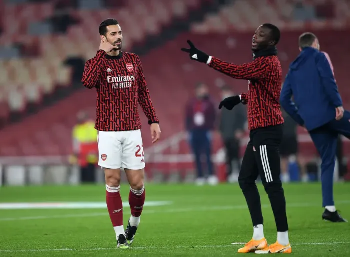 Framed Print : Arsenal's Pablo Mari and Nicolas Pepe in Pre-Match Preparation at Emirates Stadium: Carabao Cup Quarterfinal vs Manchester City