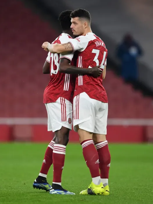 Framed Print : Arsenal's Partey and Xhaka Before Empty Emirates: Arsenal v Manchester United, 2021-22 Premier League