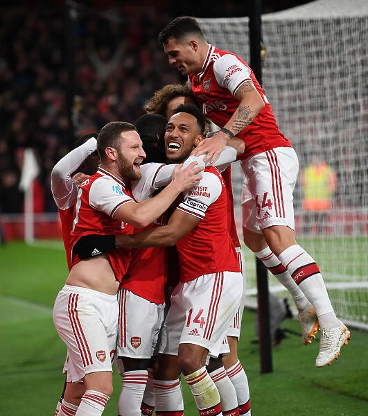 Arsenal's Pepe, Aubameyang, Mustafi, and Xhaka Celebrate Goals Against Newcastle United