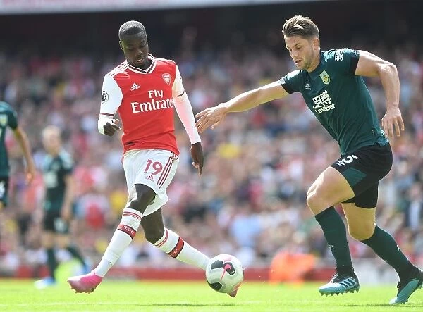 Arsenal's Pepe Clashes with Burnley's Tarkowski in Premier League Showdown