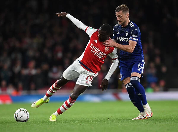 Arsenal's Pepe Clashes with Leeds Cooper in Carabao Cup Showdown