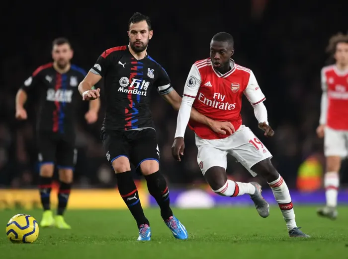 Framed Print : Arsenal's Pepe Clashes with Palace's Milivojevic in Premier League Showdown Framed Print : Arsenal's Pepe Clashes with Palace's Milivojevic in Premier League Showdown