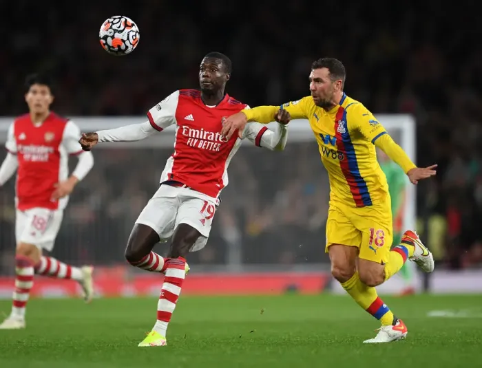 Framed Print : Arsenal's Pepe Faces Off Against Palace's McArthur in Intense Premier League Clash Framed Print : Arsenal's Pepe Faces Off Against Palace's McArthur in Intense Premier League Clash