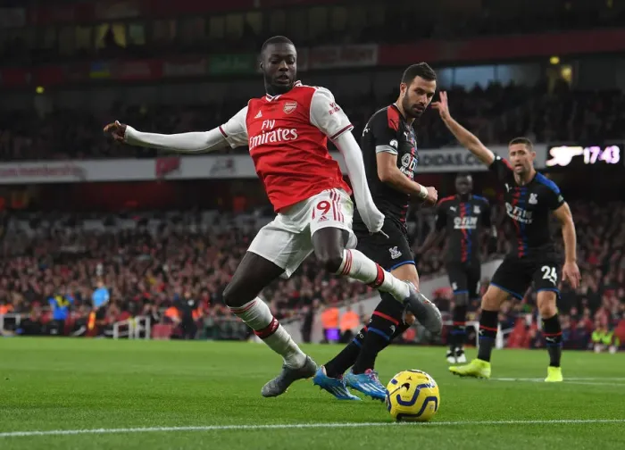 Framed Print : Arsenal's Pepe Faces Off Against Palace's Milivojevic in Premier League Clash