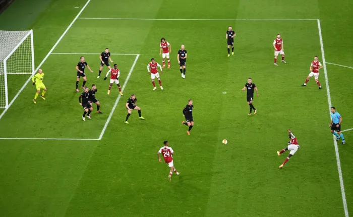 Framed Print : Arsenal's Pepe Fires Shot in Empty Europa League Clash Against Dundalk