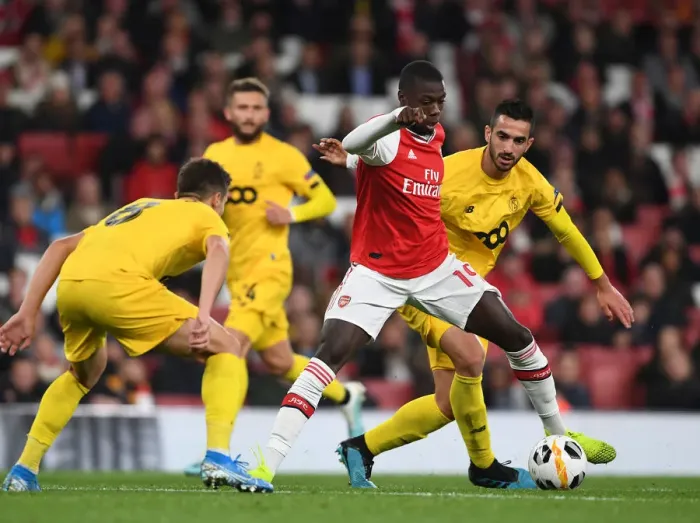 Framed Print : Arsenal's Pepe Goes Head-to-Head with Standard Liege's Cimirot in Europa League Showdown Framed Print : Arsenal's Pepe Goes Head-to-Head with Standard Liege's Cimirot in Europa League Showdown