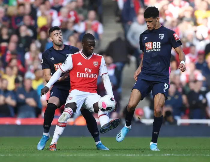 Framed Print : Arsenal's Pepe Outmaneuvers Bournemouth's Solanke in Premier League Clash Framed Print : Arsenal's Pepe Outmaneuvers Bournemouth's Solanke in Premier League Clash