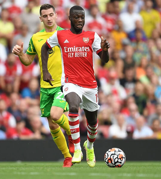 Arsenal's Pepe Outmaneuvers Norwich's McLean in Premier League Clash