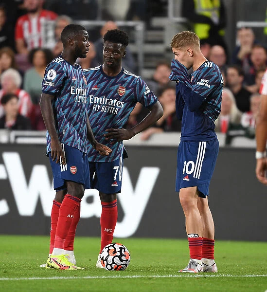 Arsenal's Pepe, Saka, and Smith Rowe in Action against Brentford (2021-22)