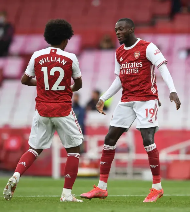 Framed Print : Arsenal's Pepe and Willian Celebrate Goals Amidst Empty Emirates Stadium Against West Bromwich Albion (2020-21)